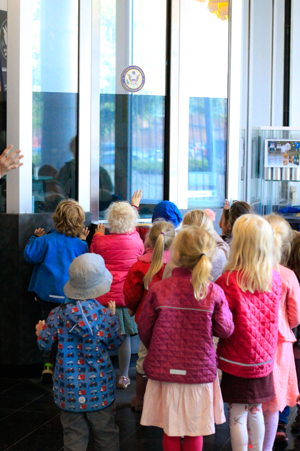 A group of forest school toddlers visit the American Embassy in Copenhagen, Denmark to learn about diplomats and diplomacy.