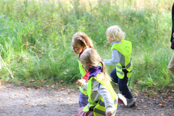 Toddlers in forest school get outside with their education and invite parents to join in on for Field Day in Denmark.